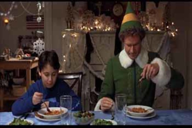 Buddy has dinner with his new family