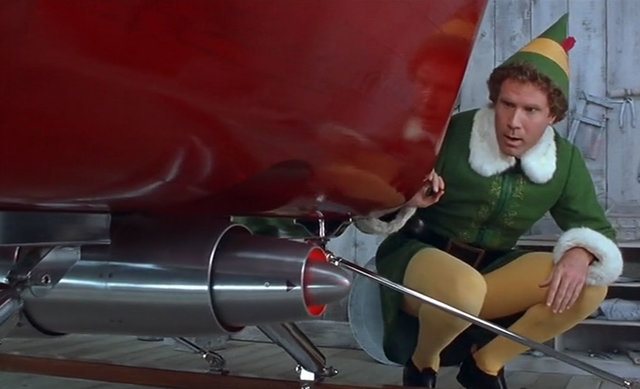 Papa elf shows Buddy santa's sliegh