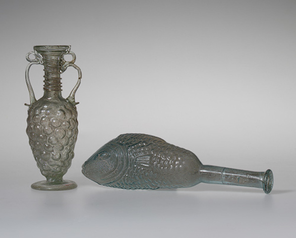 Bottle in the form of a fish and a flask in the form of grapes