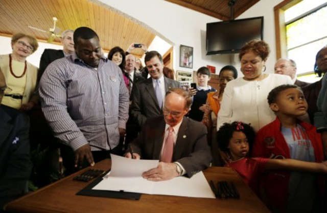 The govener of Alabama officially pardons and extonerates all nine Scottsoro Boys