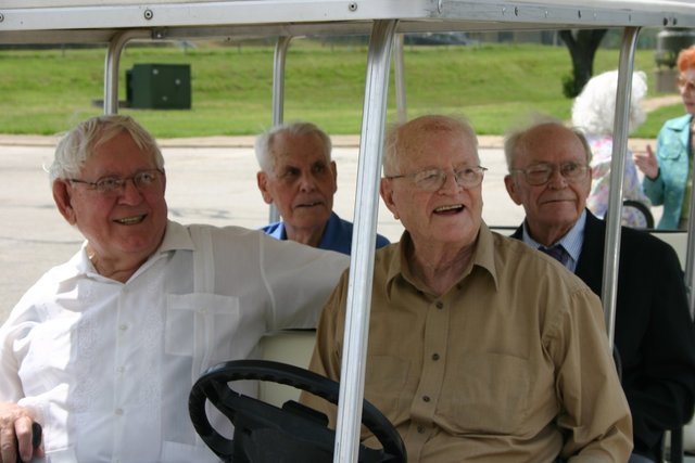 3 Men and a golf cart