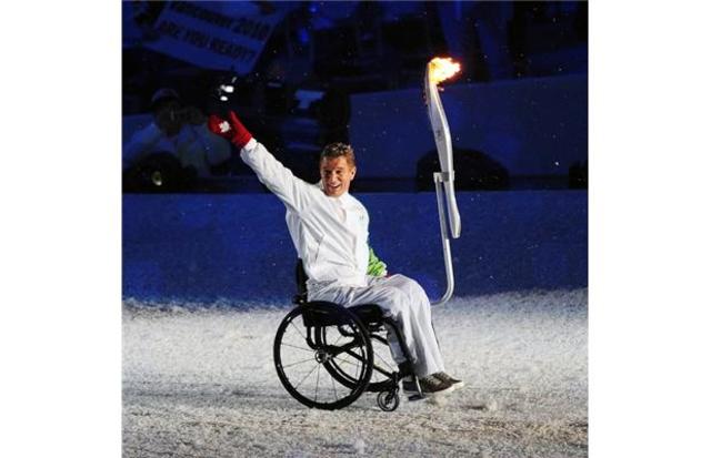 Rick Carries Olympic Torch Into Olympic Ceremony