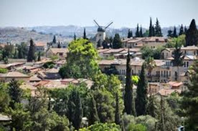 What was the first neighborhood built outside the Jews walls.