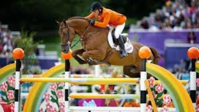 Team gold medalist at World Equestrian Games with his horse Berlin.