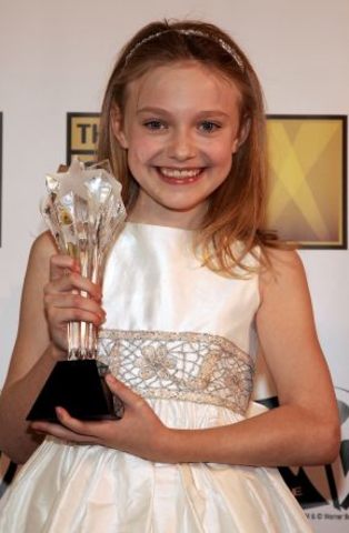 In 2002 she won the  Best Young Actor/Actress award, for her actuation in ''I'm Sam''