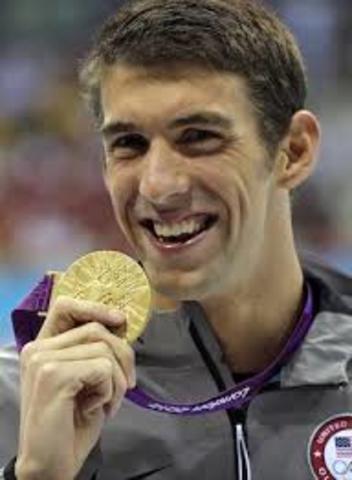 Michael Phelps Wins First Gold Medal