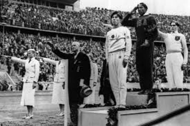 Jessie Owens wins four gold medals