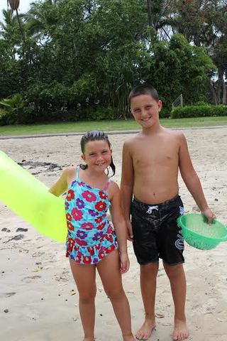 Looking for shells and sitting in the ocean