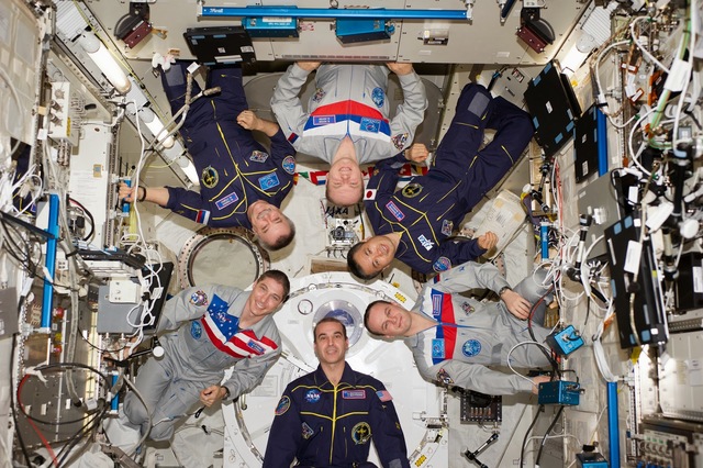 An American and Russian crew begins living aboard the international space station