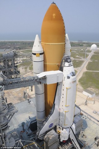 Space Shuttle Atlantis lifts off on a 12-day mission to outfit the ISS