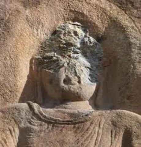 Statue of buddha is defaced.