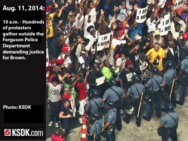 Witnesses to the shooting tell reporters that Brown had his hands raised when the officer began shooting.