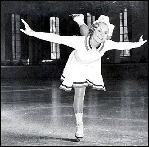 Sonja Henie wins 3rd consecutive Olympic figure skating gold.