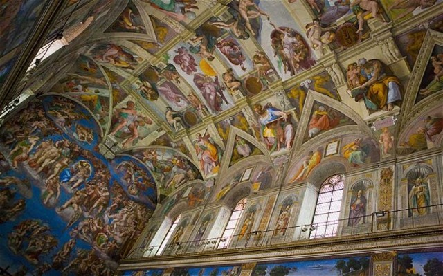 Michelangelo paints the ceiling of the Sistine Chapel
