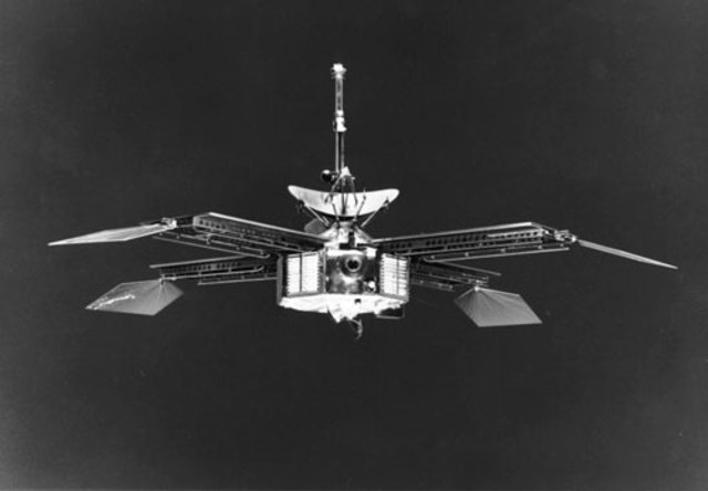 Mariner 4 flies past Mars