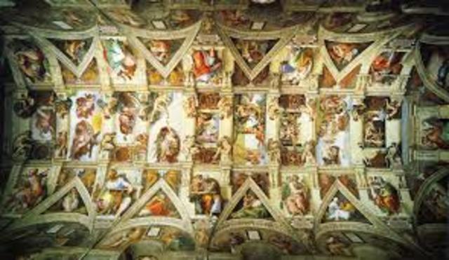 Michelangelo paints the ceiling of the Sistine Chapel