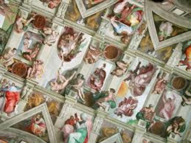 Michelangelo paints the ceiling of the Sistine Chapel