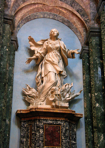 Memorizing a Prayer in Front of the St. Agnes Statue