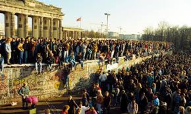 Berlin Wall falls and collapse of communism
