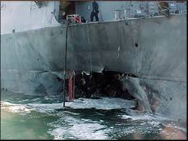 A bomb on board a small Zodiac-like boat detonates near the USS Cole in the port of Aden in Yemen, killing 17 U.S. sailors and wounding scores more