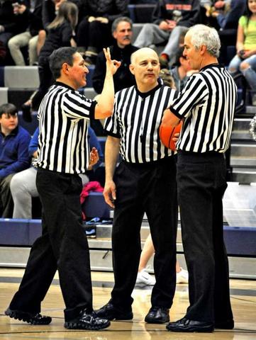 NBA adds third referee