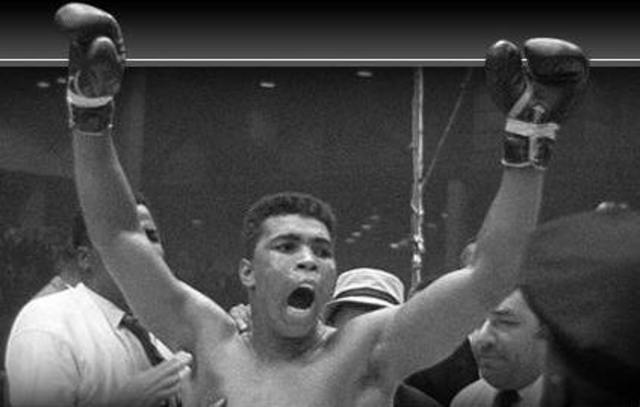 Ali defeats Foreman in "Rumble in the Jungle"