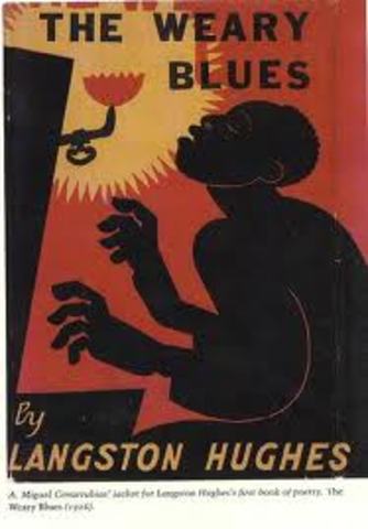Langston Hughes publishes “The Weary Blues.”
