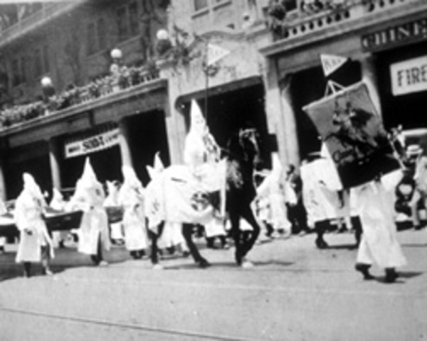 Ku Klux Klan stage a major march through Washigton D.C. Scopes trial takes place in Dayton, Tennessee.