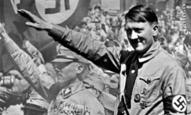 Hitler openly announces to his cabinet he will defy the Treaty of Versailles