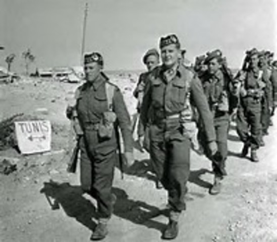 British and US forces defeat German and Italian armies in North Africa