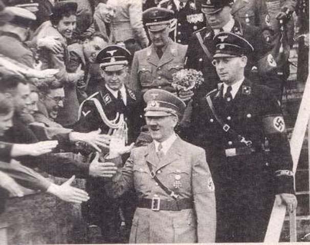 Hitler openly announces to his cabinet that he will defy the Treaty of Versailles