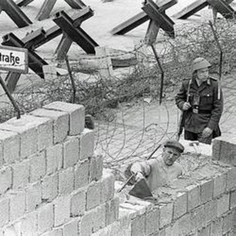 Building of Berlin Wall begins