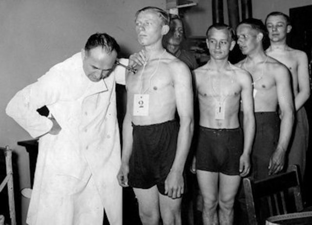 Hitler openly announces to his cabinet he will defy the Treaty of Versailles