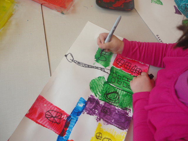 Jane drawing her tower and buildings
