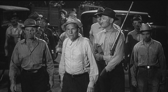 Atticus and the children stop a mob at the jail