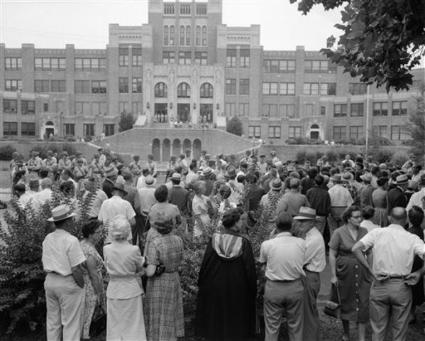 Little Rock Nine enters school through side door.