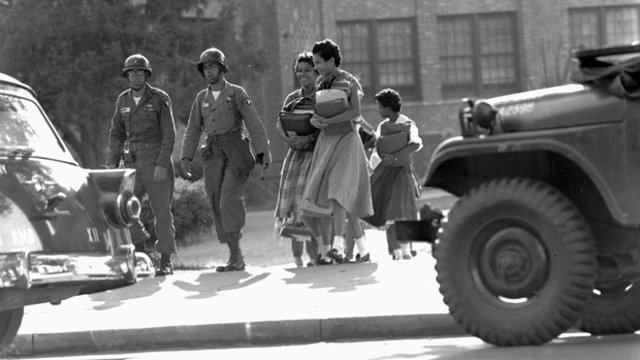 Army troops escort the nine into Central High