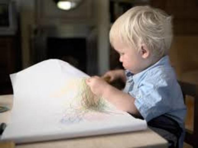 Scribbles vigorously