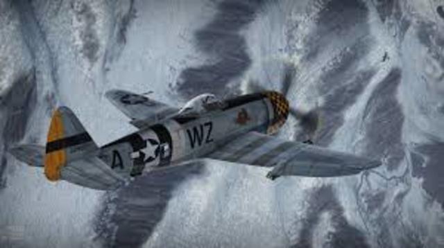 P-47 loses power over field and glides between tree and house avoding serious injury to anyone.