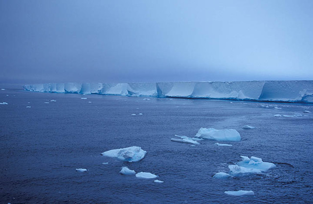 Hugh Evans and three other people sledge down Ross Ice shelf