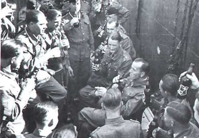 Kretschmer with his crew of the U-99 U-boat and celebrating his Knight's Cross award in 1940