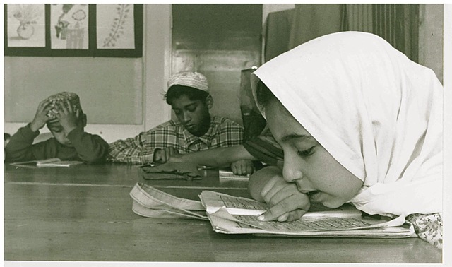 Children reading the Qur'an at Toynbee Hall