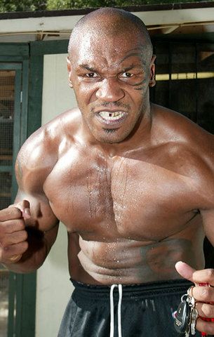 Mike Tyson strikes a parking attendant when asked to move his car