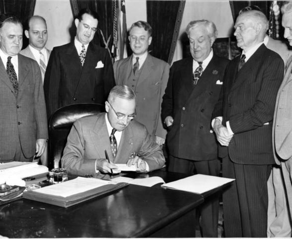 Truman signs Empployment Act