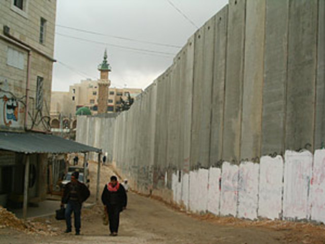 Israel begins constructing the West Bank barrier