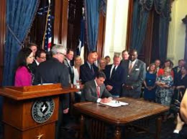 Rick Perry sighned senate bill for Chris Kyle