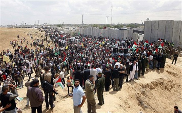 Palestinians cross the border from the Gaza Strip