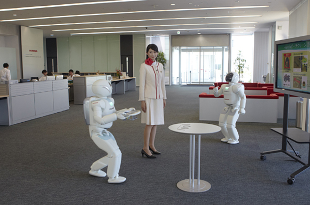 Honda's ASIMO robot, an artificially intelligent humanoid robot, is able to walk as fast as a human, delivering trays to customers in restaurant settings.