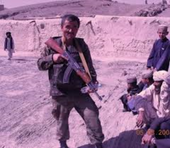 Soldiers yell at Hassan and make fun of his mother