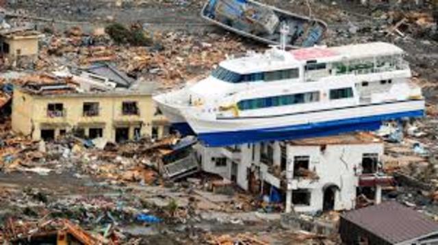 Japan is devastated by a 9.0 magnitude earthquake and tsunami